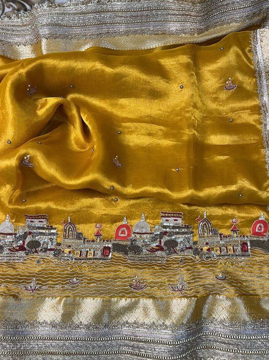 Mustard yellow Banarasi Ghat silk saree with traditional detailing