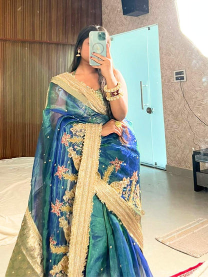 “Peacock Teal Blue Gajgamini saree with intricate embroidery and festive design”