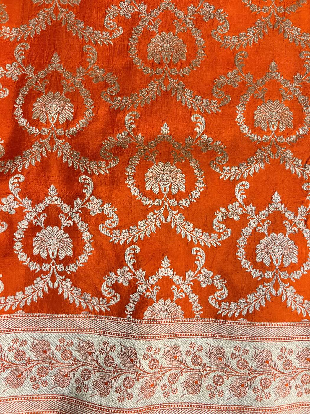 Orange Katan Silk saree with  floral jaal closeup view
