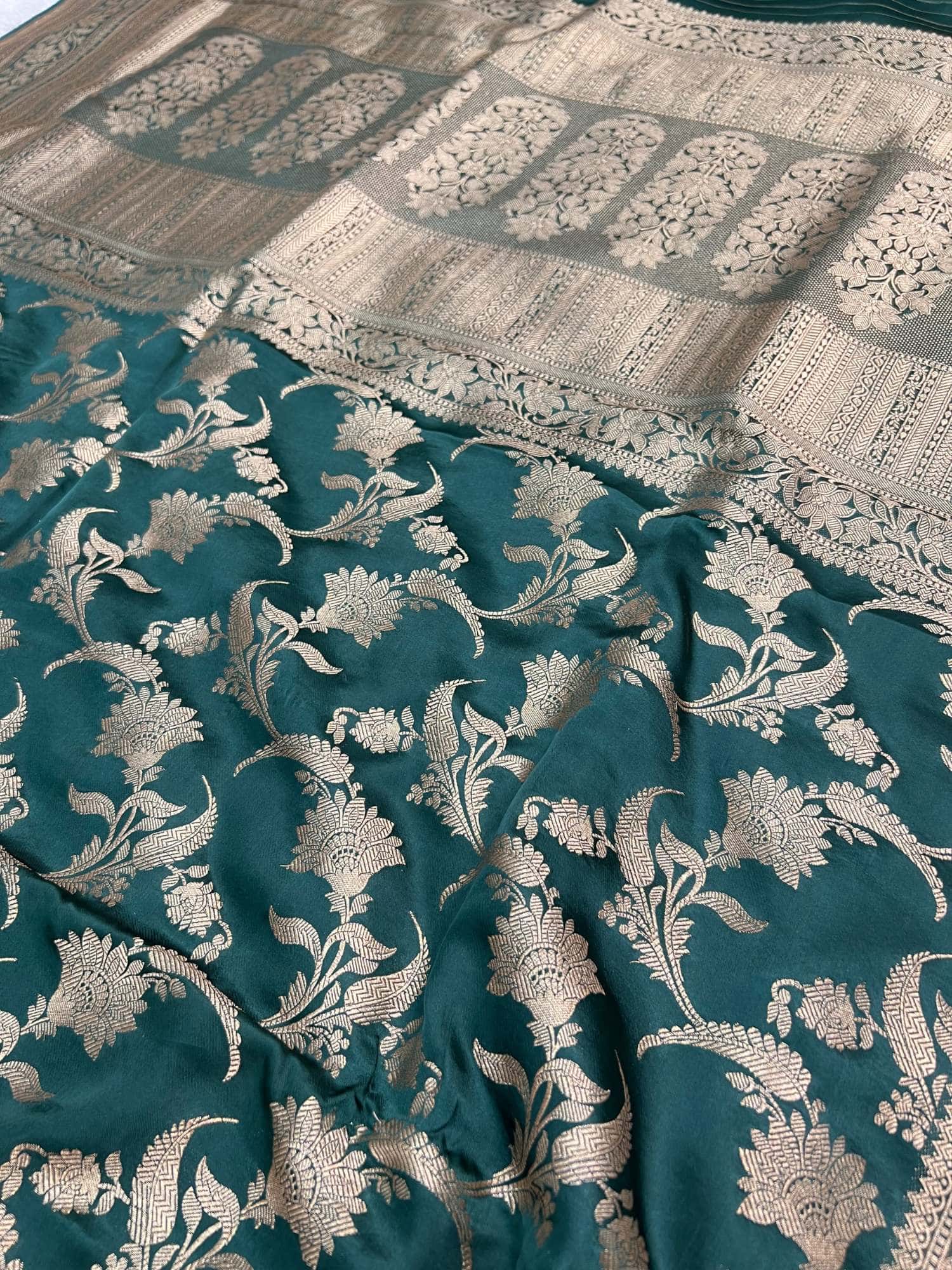 Manatavya Banaras green Chiniya silk saree showcasing flowing drape, fine weaving and festive appeal