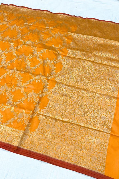 Handwoven Orange Katan Silk Saree with Floral Motifs and Contrast Border