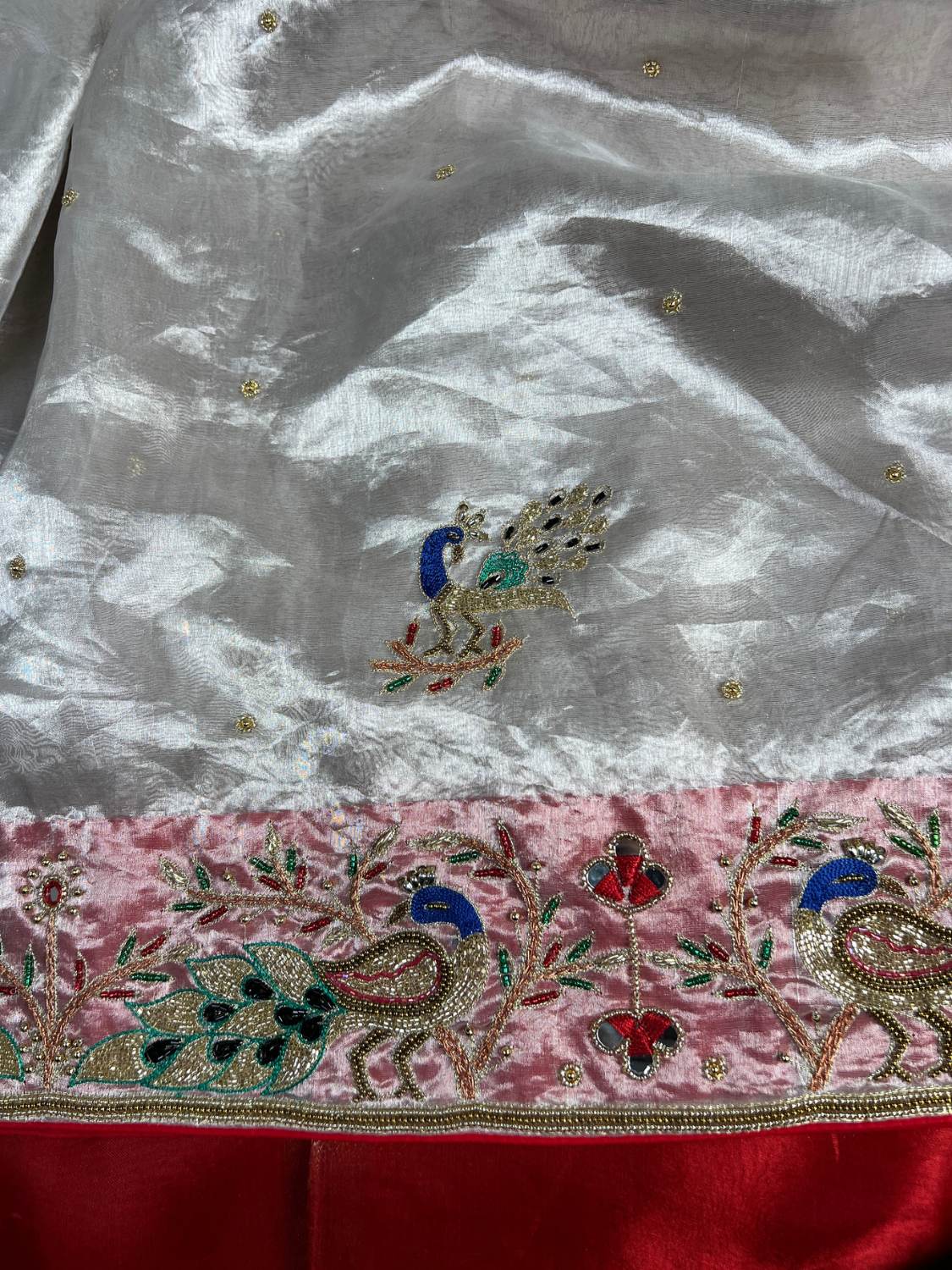 Silver Tissue Silk Saree Lal Ishq with Hand-embroidered Floral And Peacock closeup view 