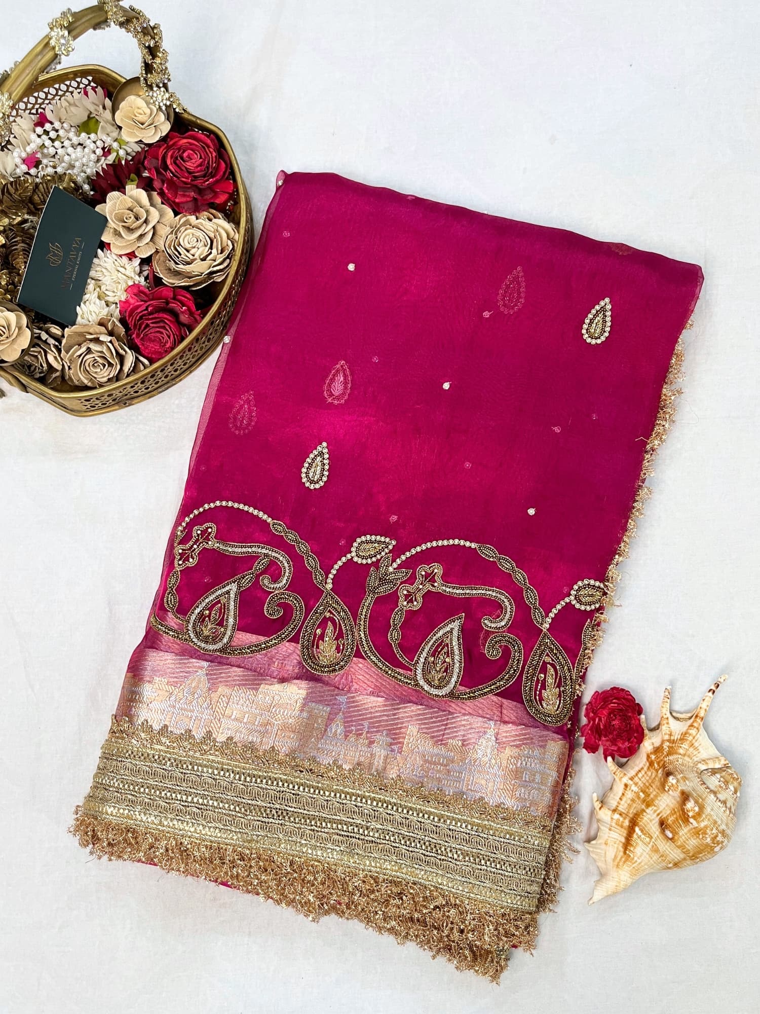 Hand-embroidered pink tissue silk saree featuring zari paisley motifs and a rich golden border by Mantavya Banaras