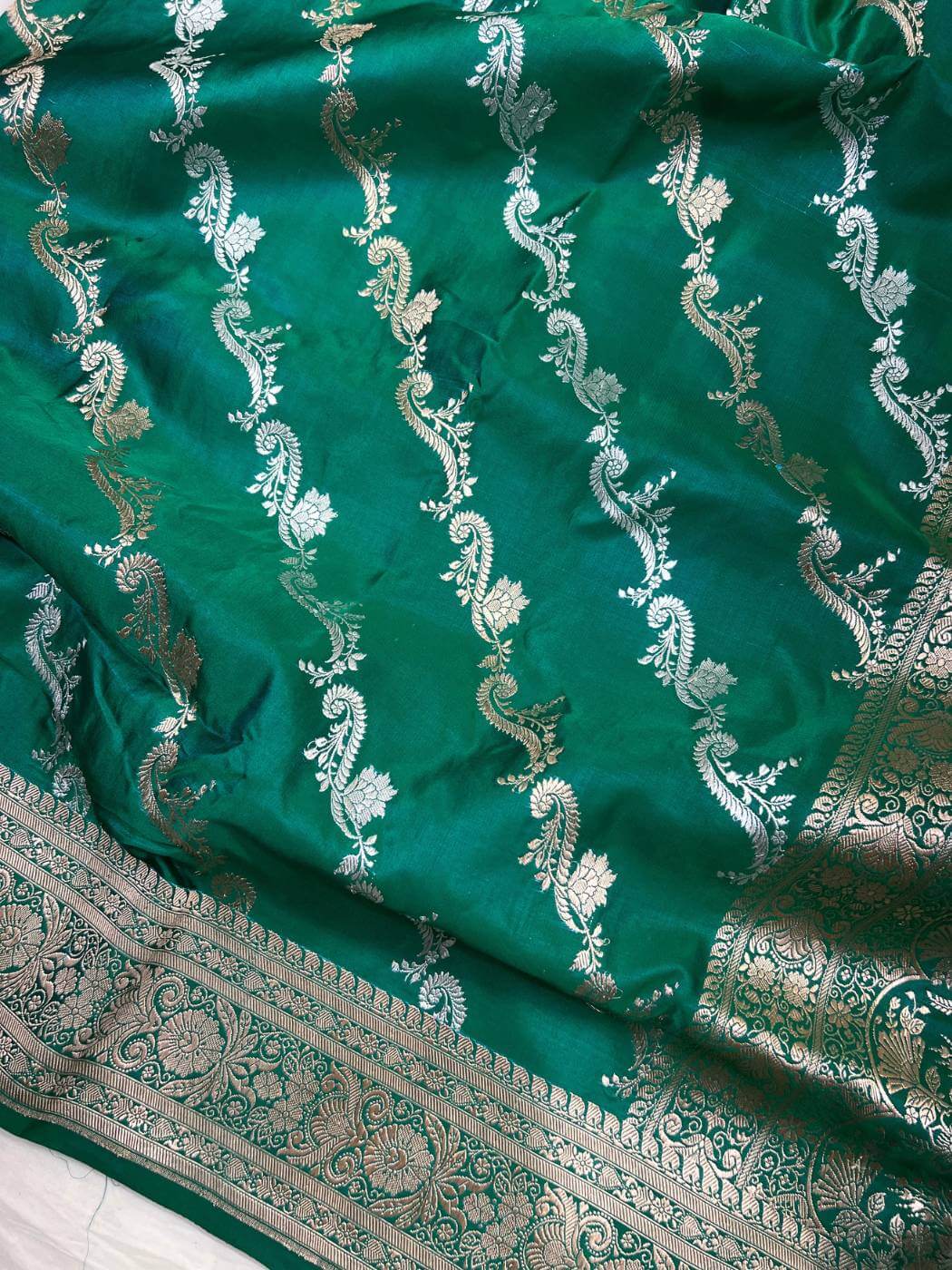 Emerald Green Katan Silk Saree with intricate silver zari closeup view 01