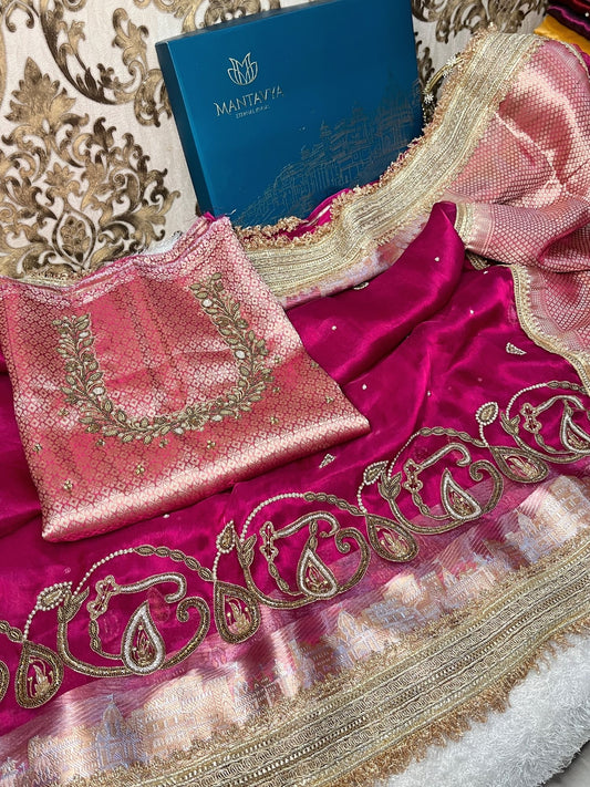 Hand-embroidered pink tissue silk saree featuring zari paisley motifs and a rich golden border by Mantavya Banaras