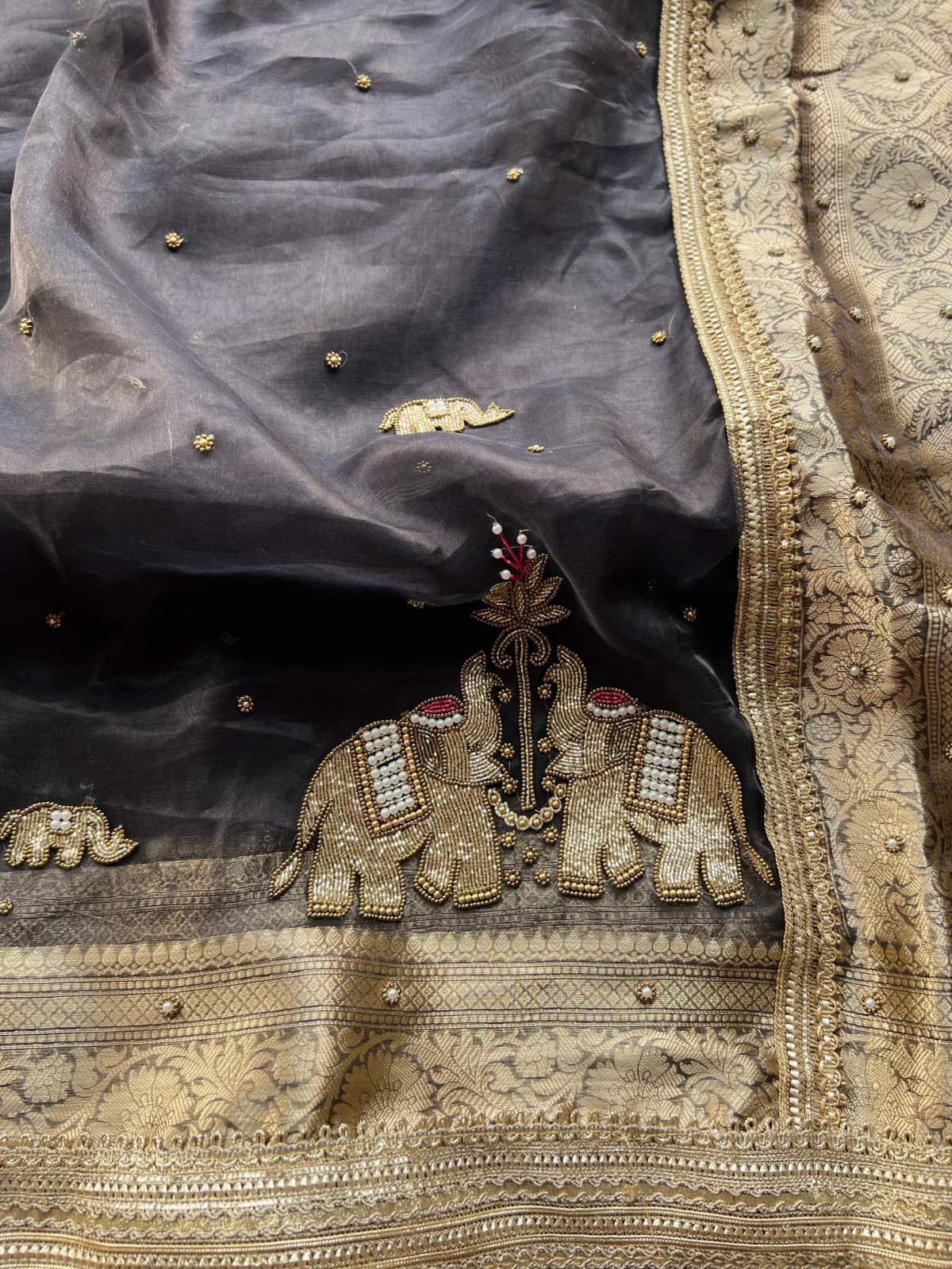 Black Black Tissue Silk Saree Gajraaj  with Hand Embroidered Elephant closeup view