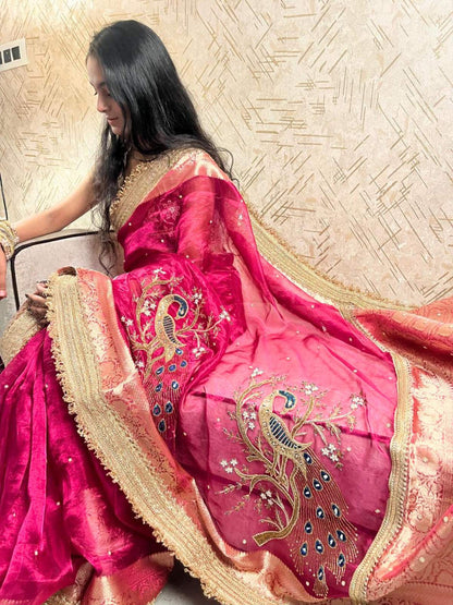 Hot pink hand-embroidered Banarasi tissue silk saree with intricate mori (peacock) motif and rich traditional detailing. - Mantavya Banaras
