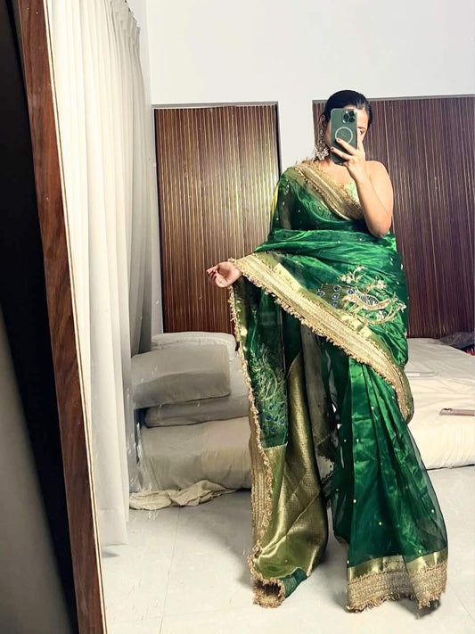 “Bottle Green Morni silk saree with intricate design and festive appeal”