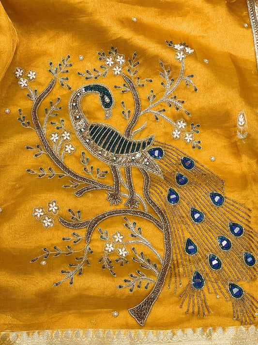 Manatavya Banaras yellow Morni tissue silk saree with handwoven peacock motifs, lightweight drape and elegant festive design