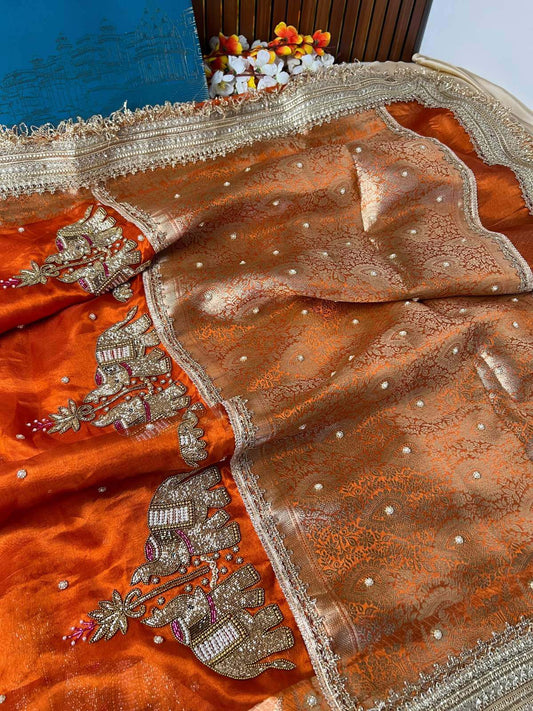 Orange Tissue Silk Saree elephant motifs  closeup view