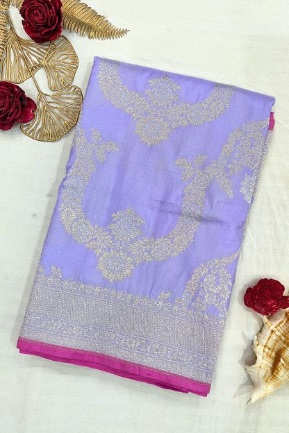 Handwoven Lilac Katan Silk Saree with gold and silver zari floral motifs, contrast selvedge border, and matching unstitched blouse