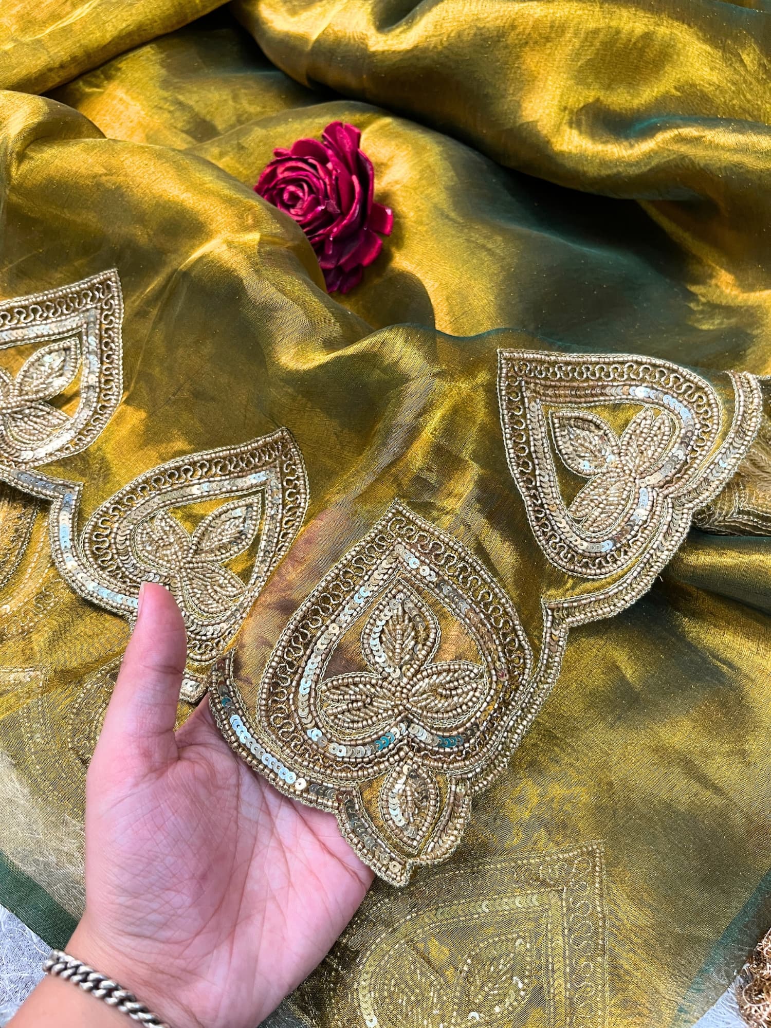 Hand-Embroidered Green Sahiba Tissue Silk Saree from Mantavya Banaras featuring intricate handcrafted motifs, perfect for weddings and festive occasions.