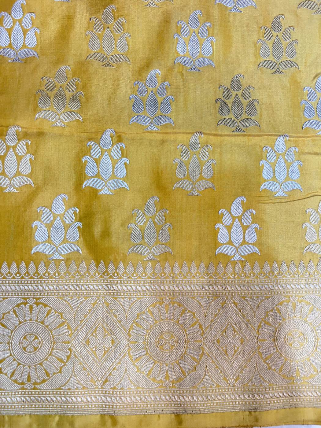 Yellow Katan Silk Saree with floral buta closeup view