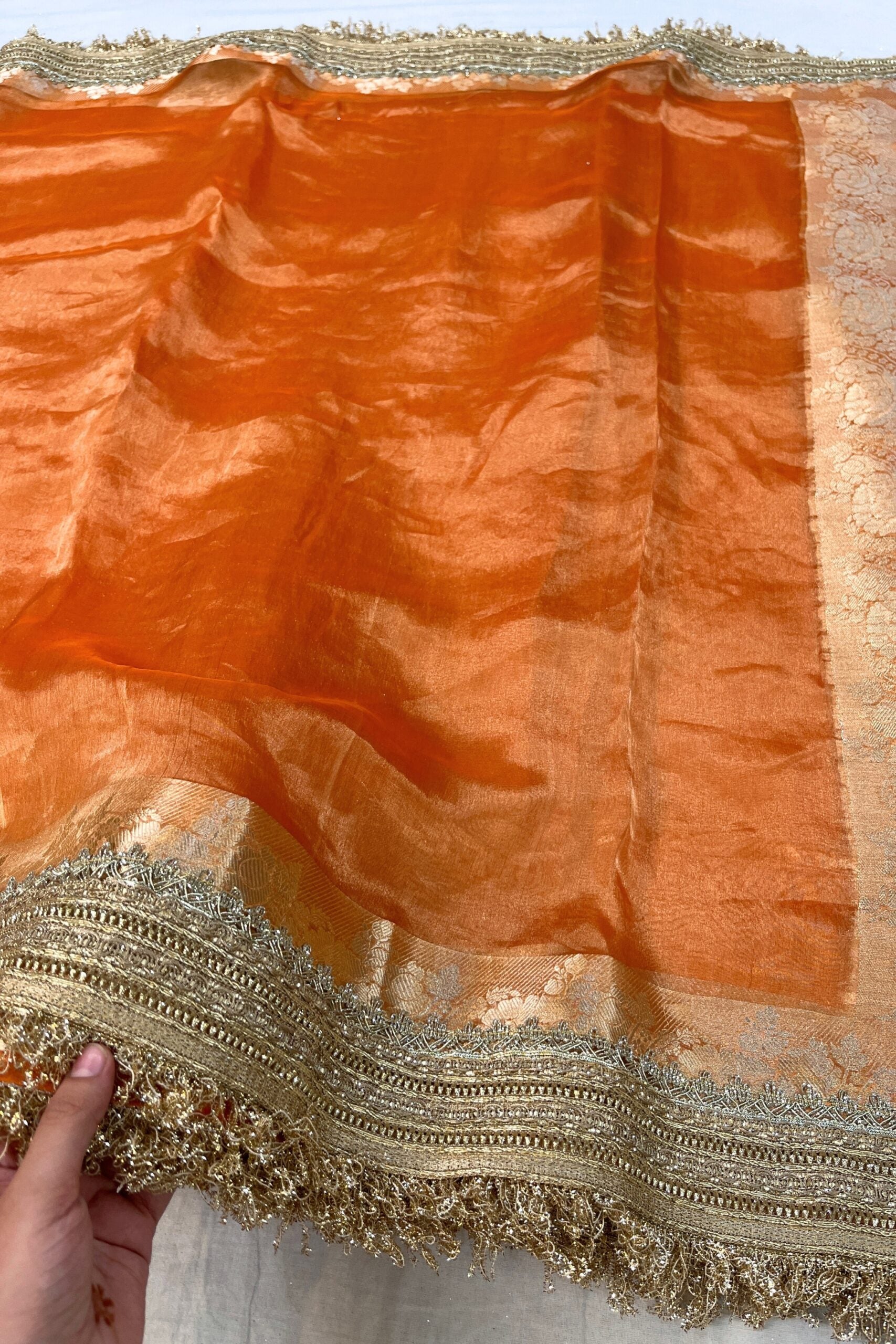 Orange Pure Banarasi Tissue Silk Saree with Gota Patti border, rich brocade Aachal, and unstitched brocade blouse piece – handcrafted in Banaras.
