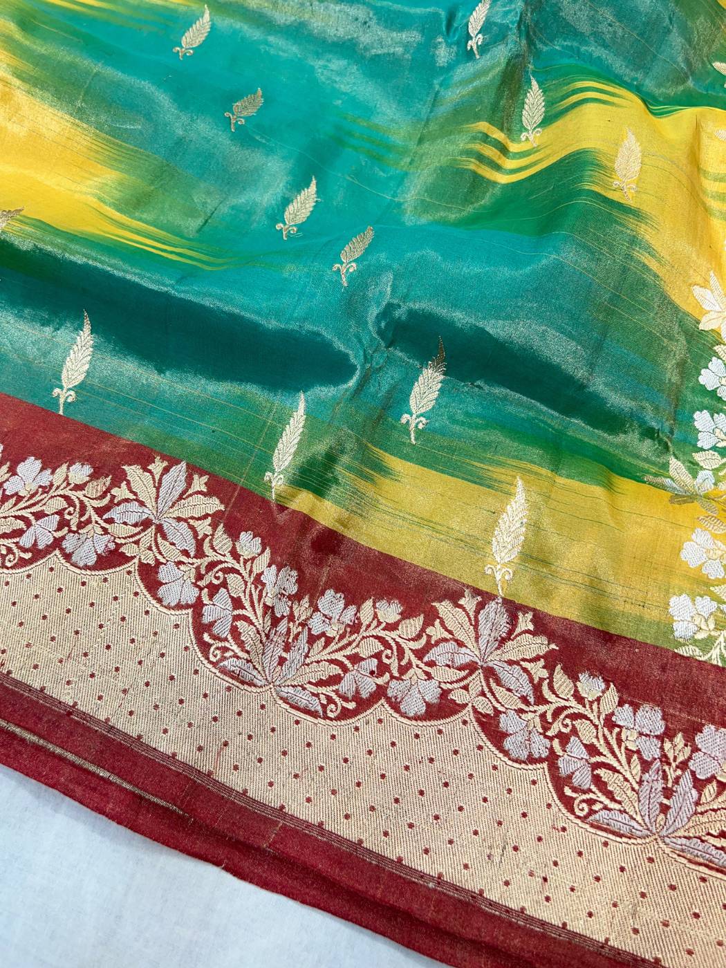 Multicolor Tissue Katan Silk Saree with zari butis and shimmering closeup view 02