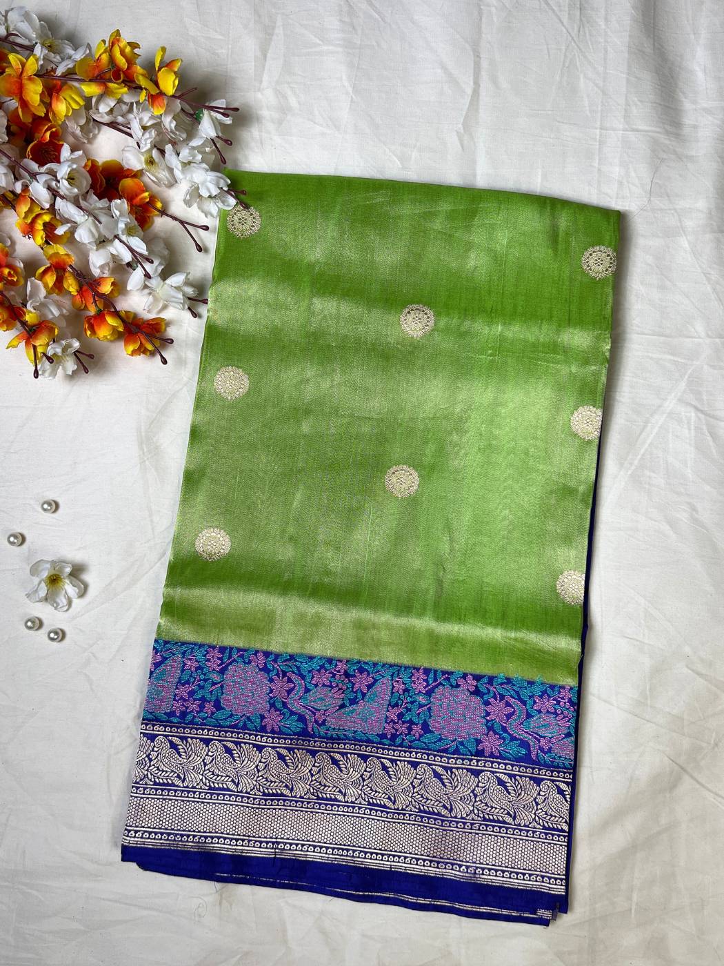 Lime Green tissue silk saree with Elegant zari woven circular butti front view