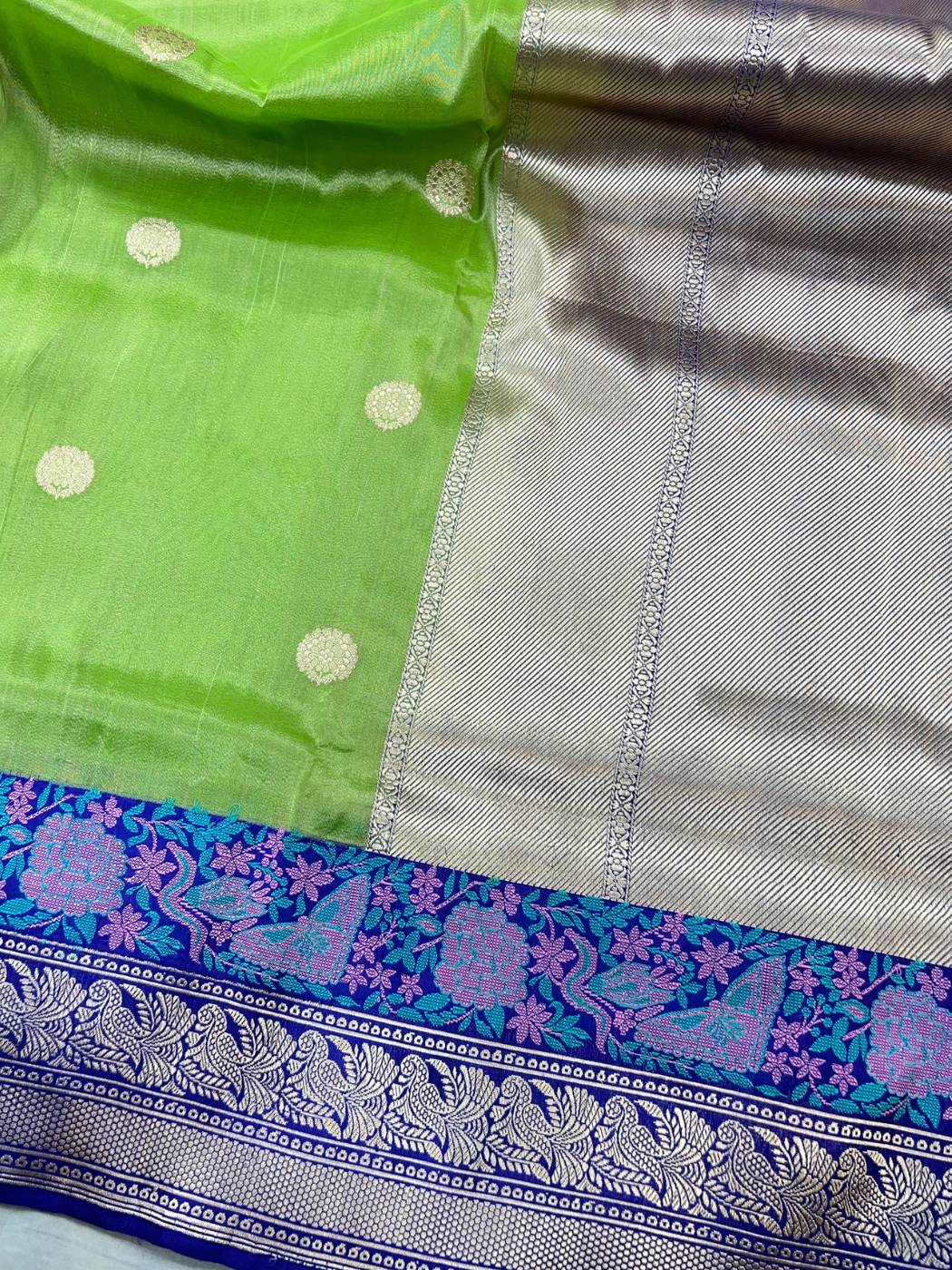 Lime Green tissue silk saree with Elegant zari woven circular butti closeup view 01