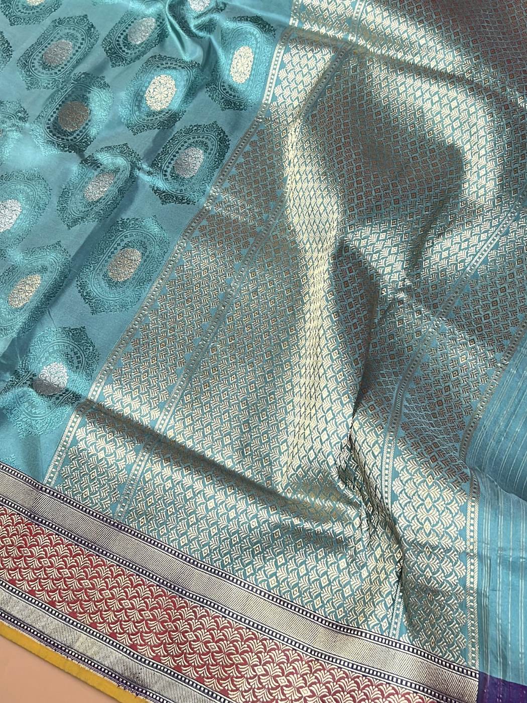 Aqua Blue Mashru Silk Saree with oval medallion closeup view 01