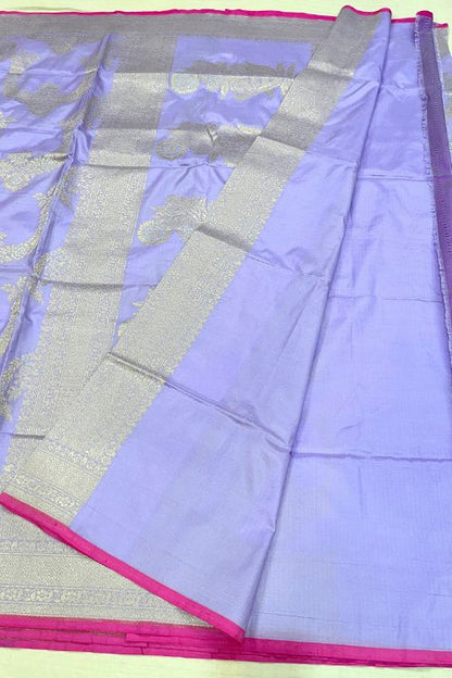 Handwoven Lilac Katan Silk Saree with gold and silver zari floral motifs, contrast selvedge border, and matching unstitched blouse