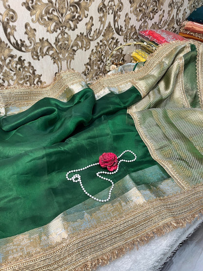 Bottle green pure Banarasi tissue silk saree with gota patti border, rich brocade aachal, and matching unstitched brocade blouse piece.