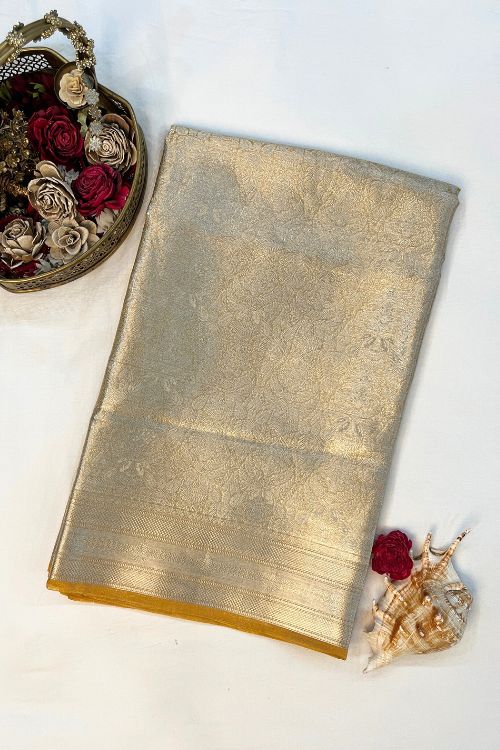 Yellow Brocade Tissue Silk Saree with Silver Zari and Unstitched Blouse showcasing intricate traditional design