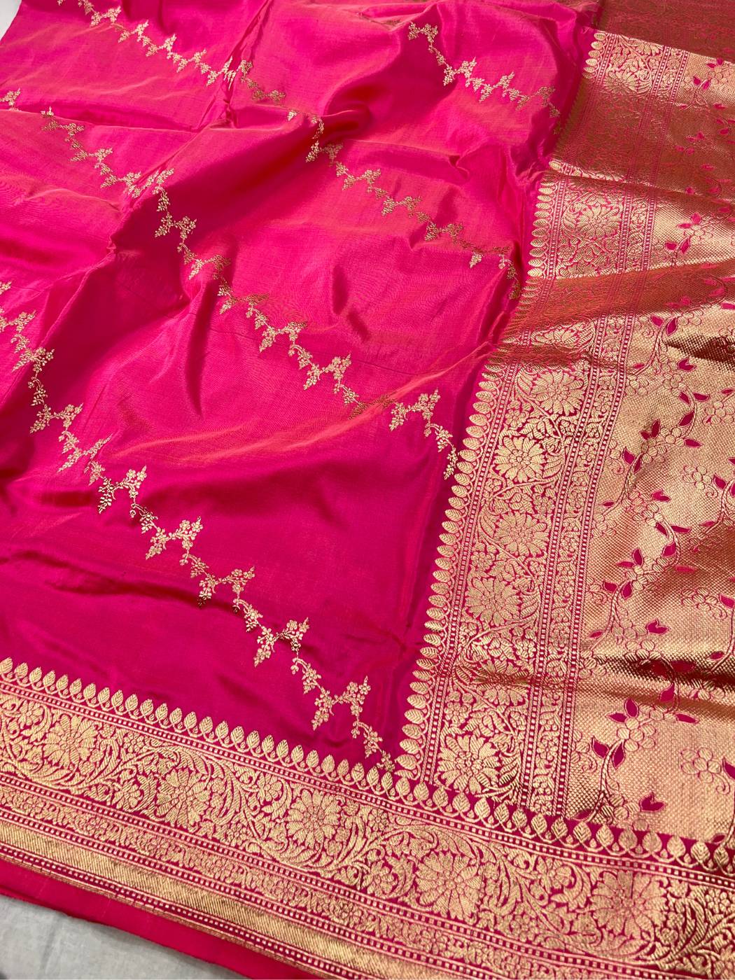 Rani Pink katan silk saree with golden zari weaving closeup view 01