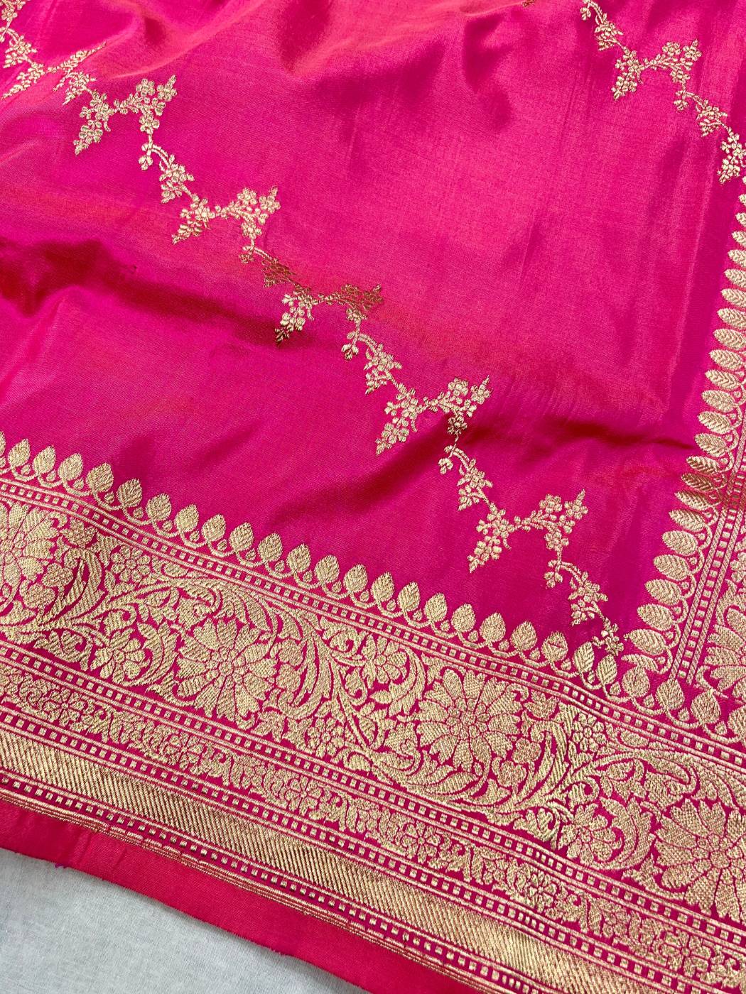 Rani Pink katan silk saree with golden zari weaving closeup view 02