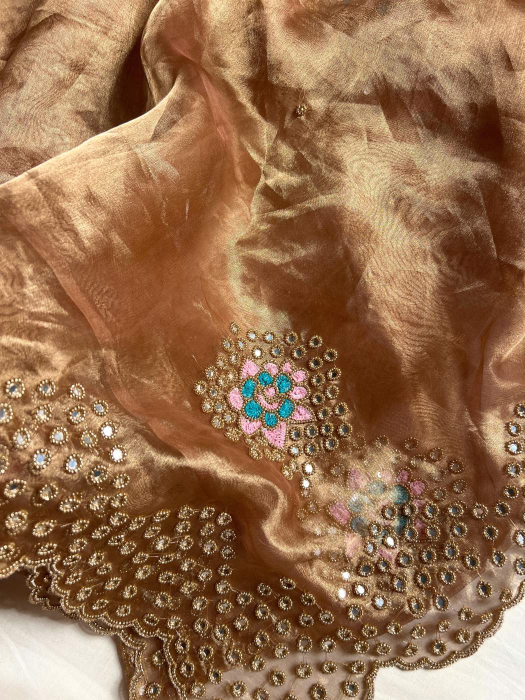 Copper Brown Tissue Silk Saree with  mirror detailing and elegant scalloped border closeup iew