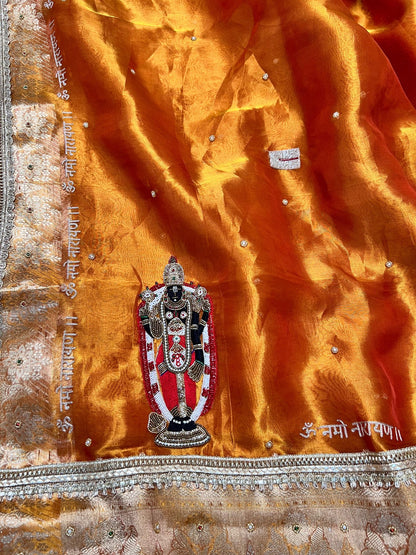 100% Pure Banarasi Tissue Silk Saree with Shri Bala Ji Tirupati Balaji Venkateshwar embroidery in golden-orange shade, traditional Banarasi Tissue Silk saree for festive and wedding wear