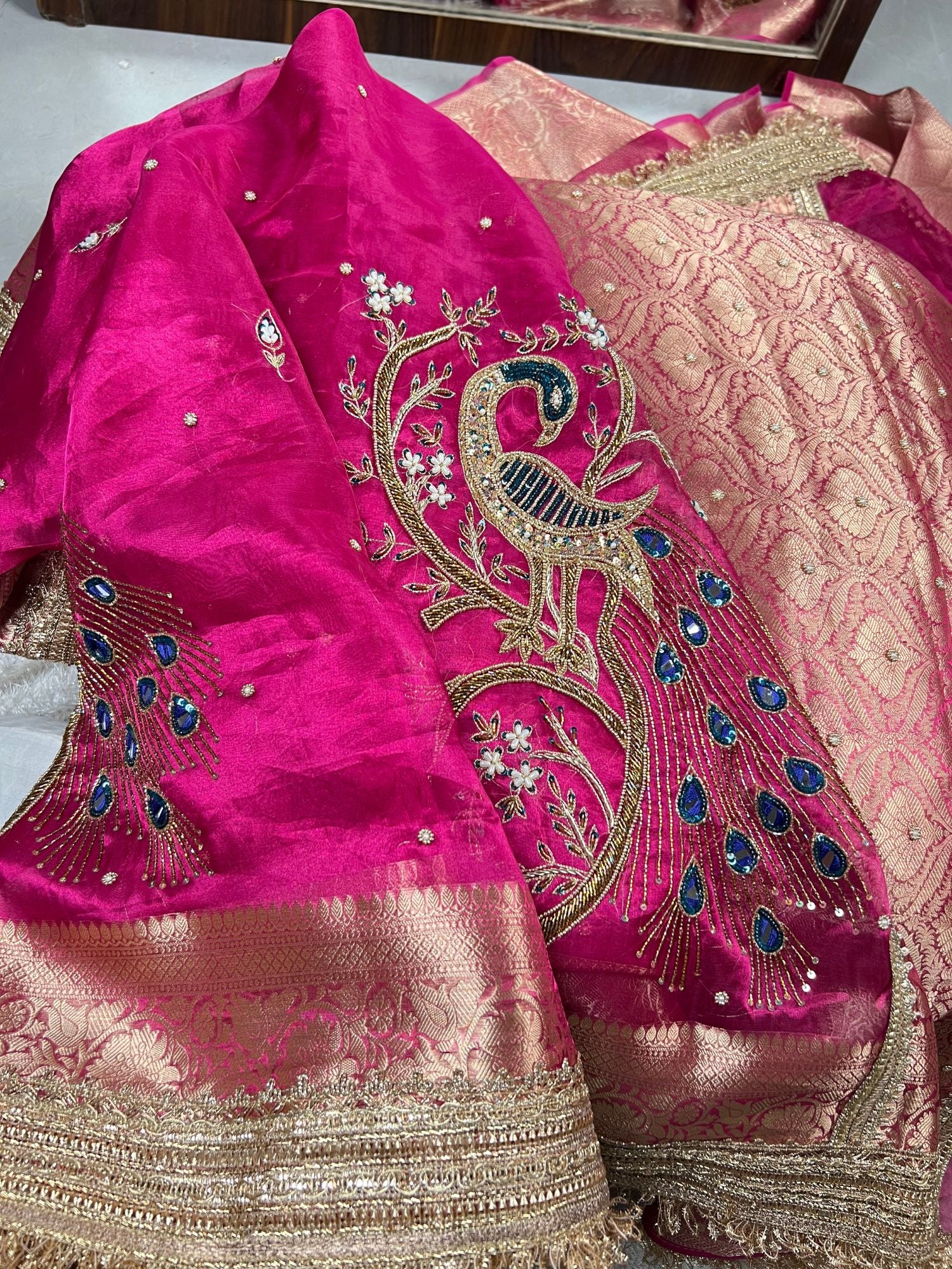 Hot Pink Morni Saree featuring luxury hand embroidery on premium Banarasi tissue silk with graceful peacock motifs - Mantavya Banaras.