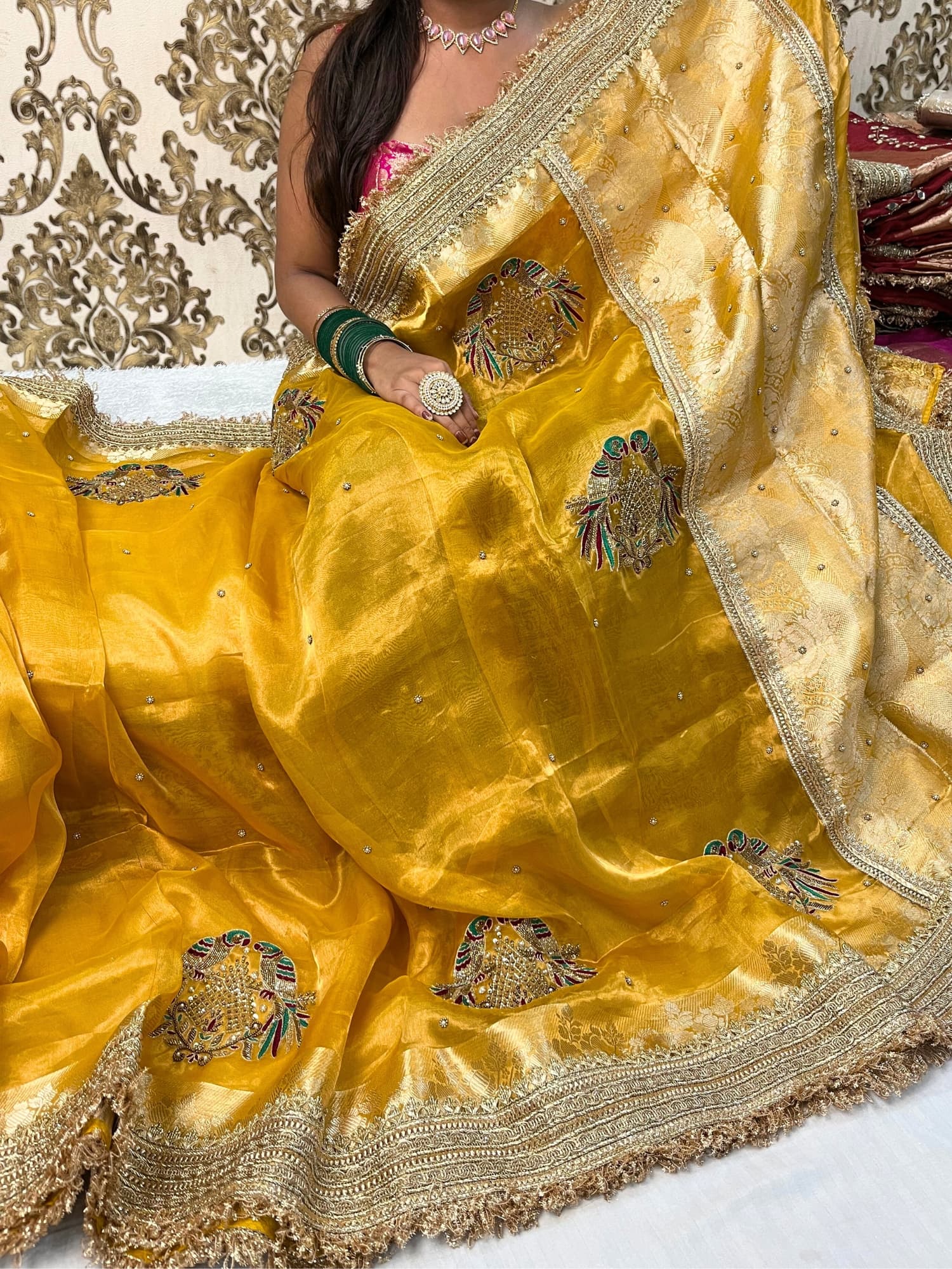 Yellow Tissue Silk Saree with hand-embroidered double parrot and leaf motifs, paired with a brocade blouse