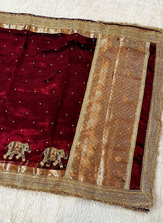 Hand-embroidered maroon tissue silk saree with golden elephant motifs – Banarasi traditional wear