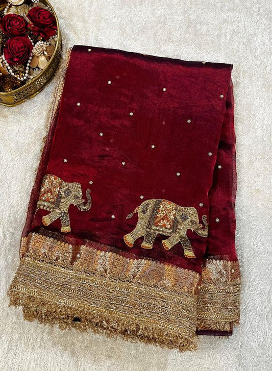Hand-embroidered maroon tissue silk saree with golden elephant motifs – Banarasi traditional wear