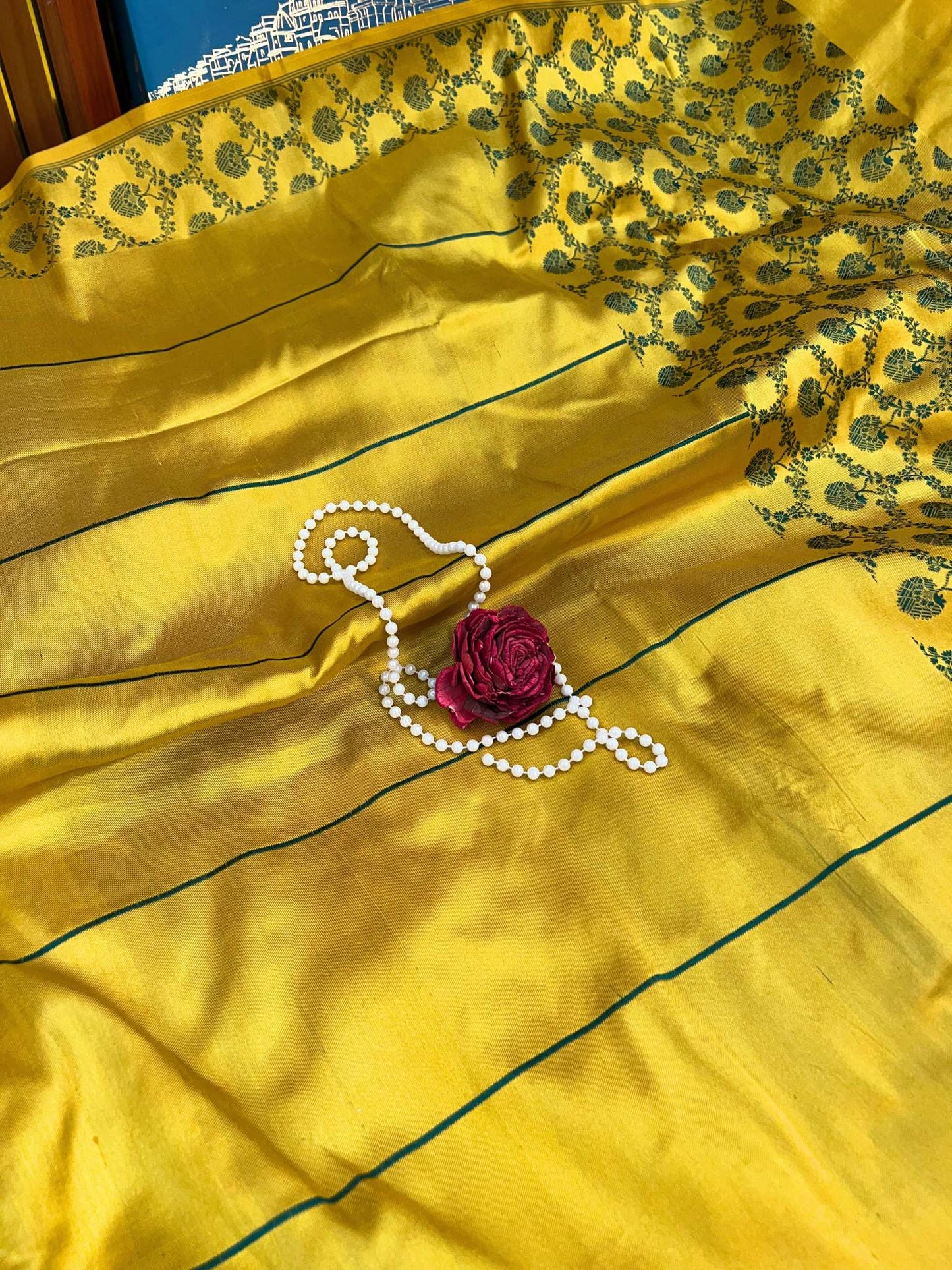 Beautiful yellow silk saree featuring traditional drape and soft glossy fabric - mantavya banaras