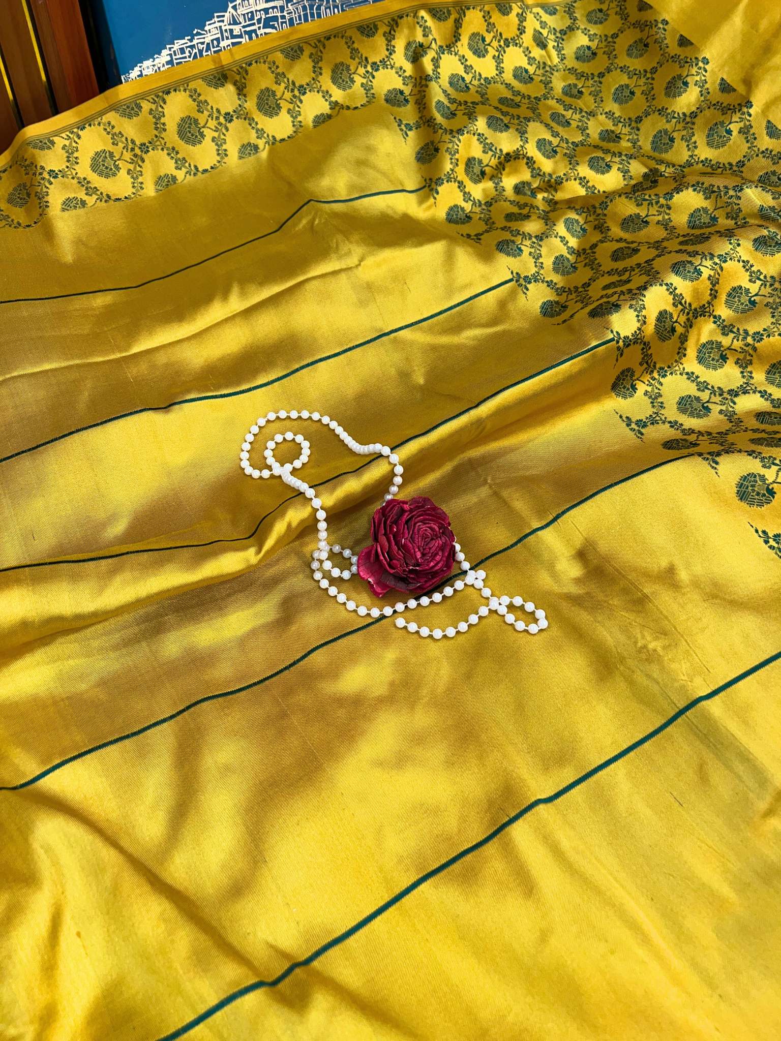 Beautiful yellow silk saree featuring traditional drape and soft glossy fabric - mantavya banaras