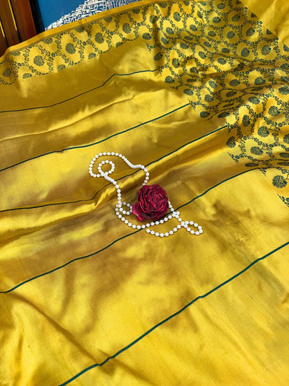 Beautiful yellow silk saree featuring traditional drape and soft glossy fabric - mantavya banaras