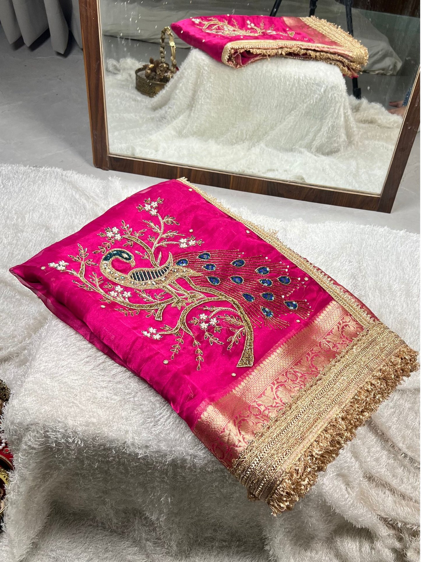 Hot pink hand-embroidered Banarasi tissue silk saree with intricate mori (peacock) motif and rich traditional detailing. - Mantavya Banaras