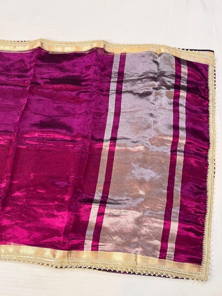 Wine Banarasi Tissue Silk Saree with mirror jaal embroidery, scattered butis, and unstitched brocade blouse – handwoven festive wear from Banaras.