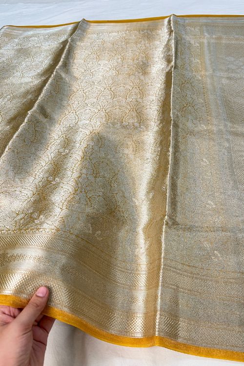 Yellow Brocade Tissue Silk Saree with Silver Zari and Unstitched Blouse showcasing intricate traditional design