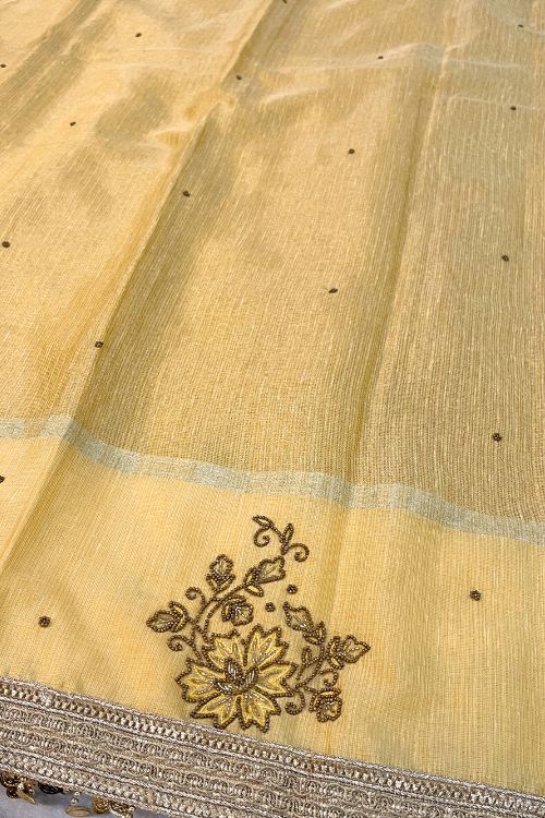 Hand-Embroidered Gold Linen Tissue Silk Saree with intricate embroidery, perfect for weddings and special occasions.