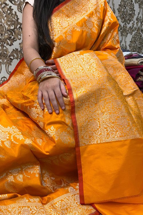 Handwoven Orange Katan Silk Saree with Floral Motifs and Contrast Border