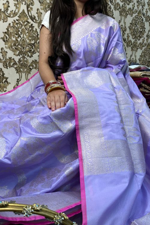 Handwoven Lilac Katan Silk Saree with gold and silver zari floral motifs, contrast selvedge border, and matching unstitched blouse