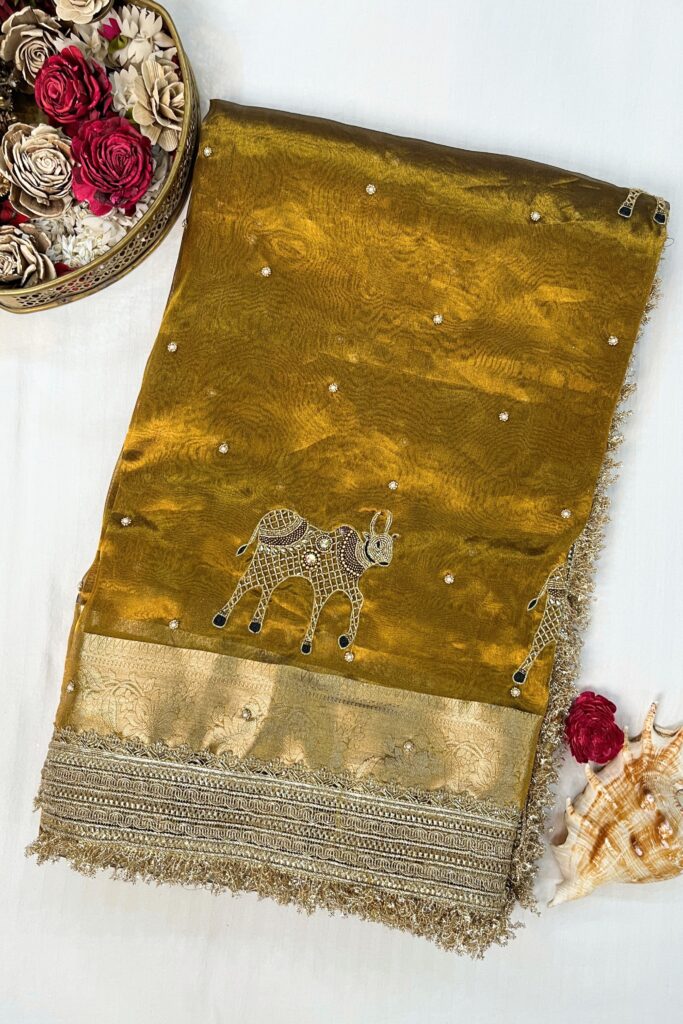 Hand Embroidered Mehndi Green Banarasi Tissue Silk Saree with Nandi buta and intricate detailing, perfect for weddings and festive occasions.