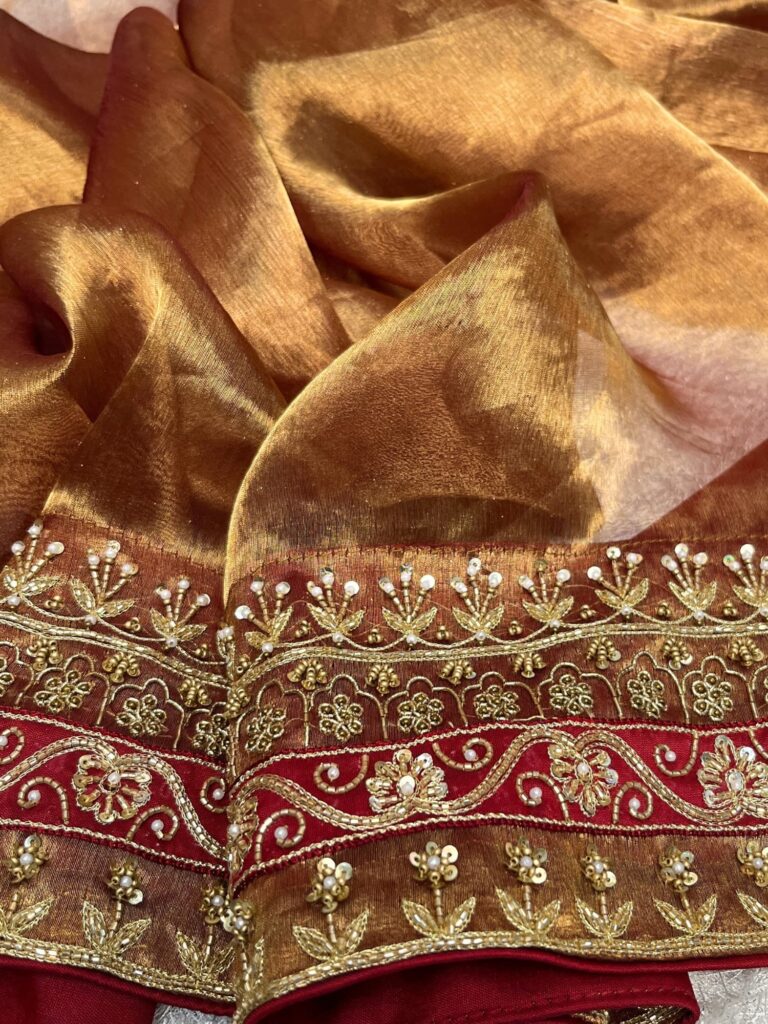 Hand Embroidered Copper Brown Banarasi Tissue Silk Saree with maroon patchwork border and matching embroidered blouse piece – perfect for weddings and festive occasions.