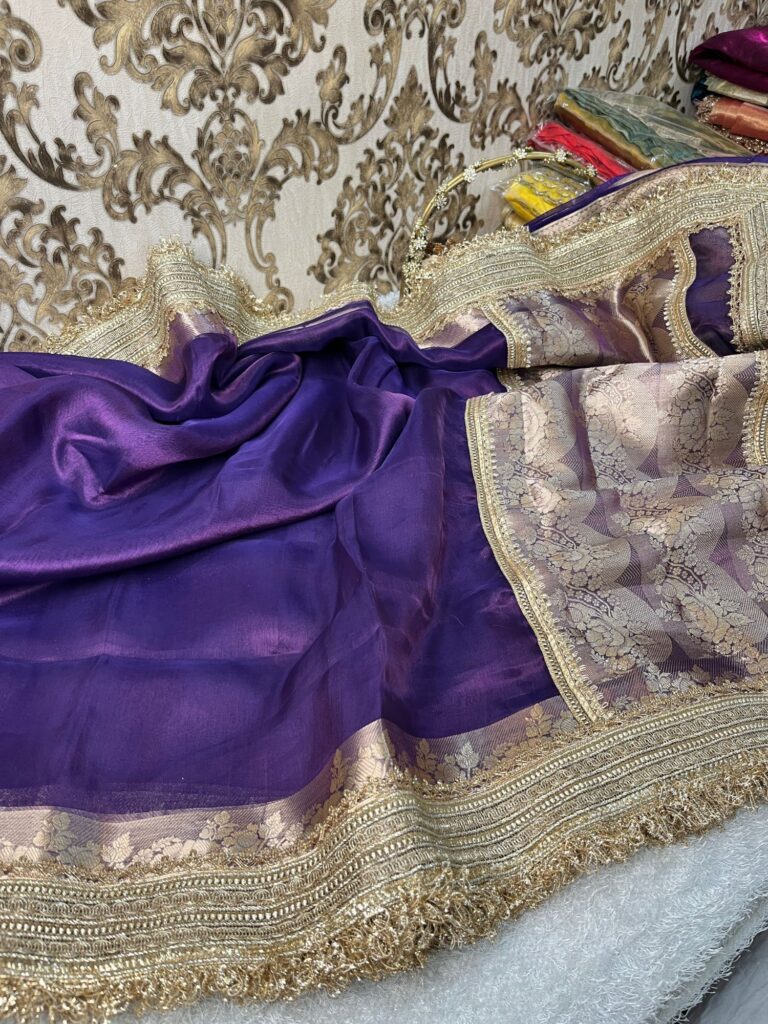Violet Banarasi tissue silk saree with butis, gota patti border, brocade aachal, and unstitched brocade blouse.