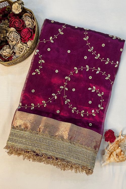 Hand Embroidered Wine Jaal Tissue Silk Saree featuring mirror work embroidery and scattered buti design, paired with unstitched wine blouse – elegant ethnic wear for weddings and festive occasions.