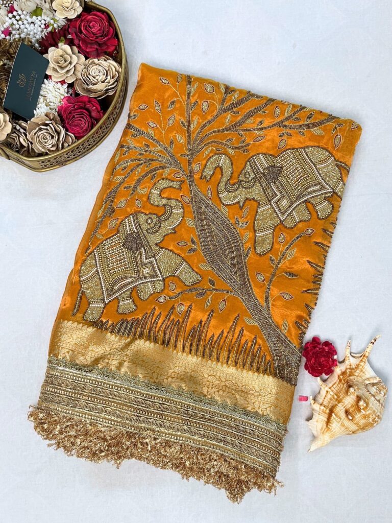 Yellow Tissue Silk Saree with twin elephant hand embroidery