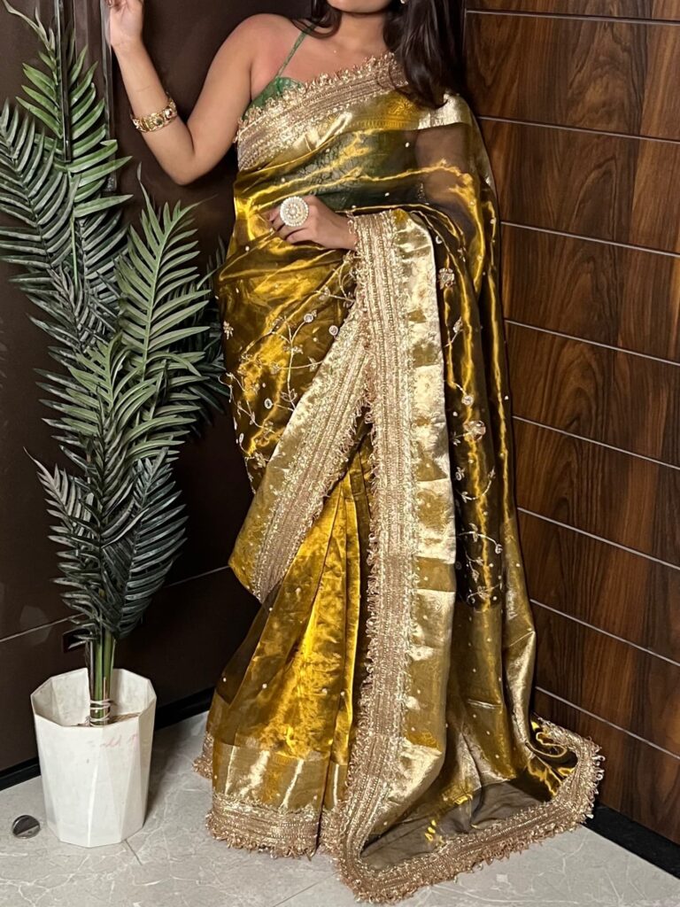 Gulmohar Mehendi green tissue silk saree with hand embroidery, birds and floral work, zari border