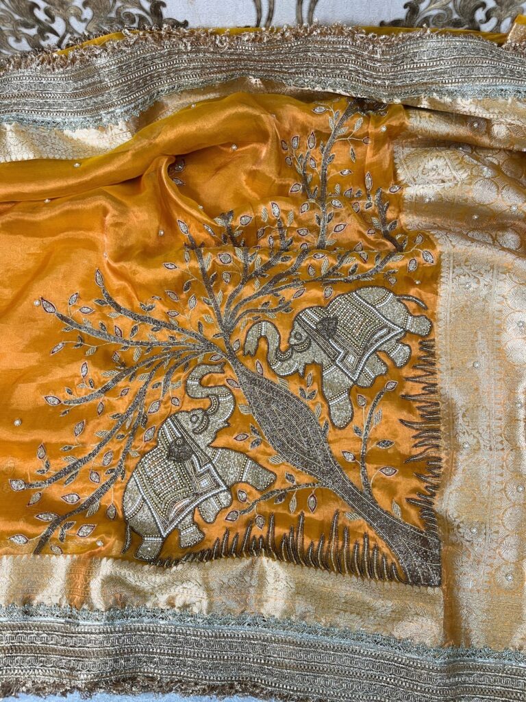 Yellow Tissue Silk Saree with twin elephant hand embroidery