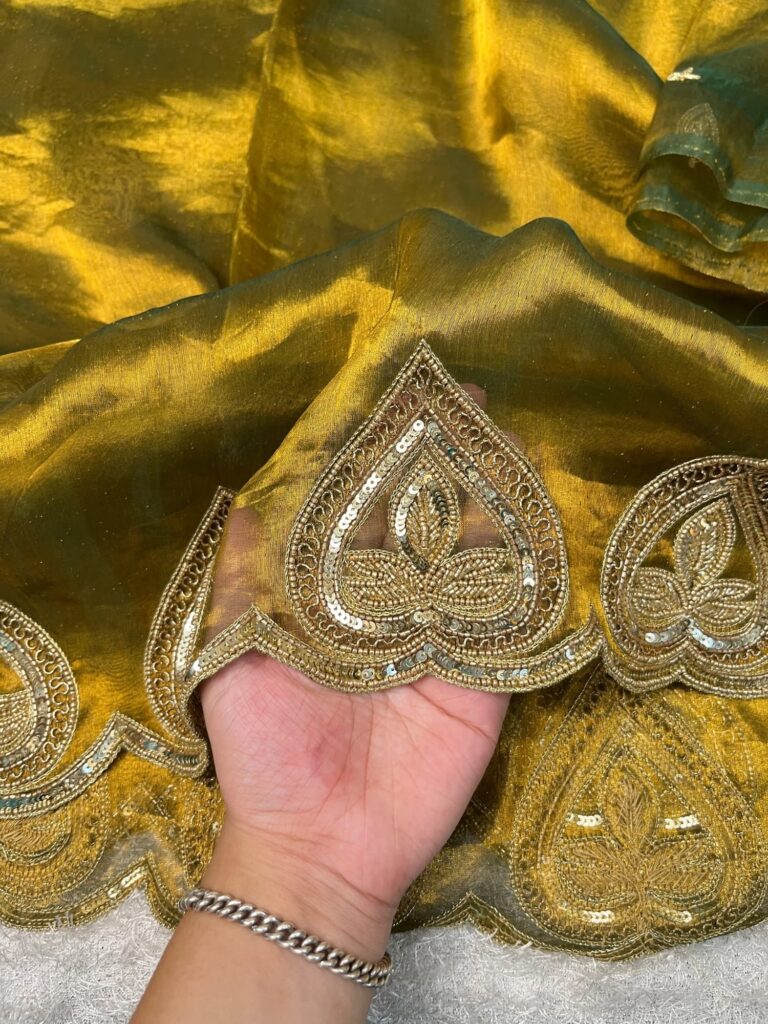 Hand-Embroidered Green Sahiba Tissue Silk Saree from Mantavya Banaras featuring intricate handcrafted motifs, perfect for weddings and festive occasions.